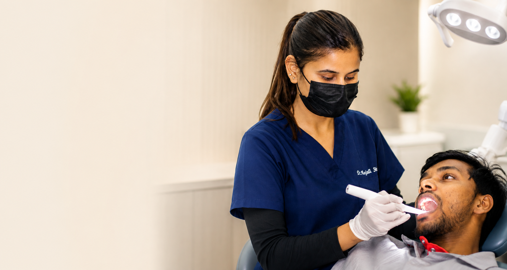 Dr. Anjali Singh treating a patient at Nirvighnam Dental & Implant Clinic